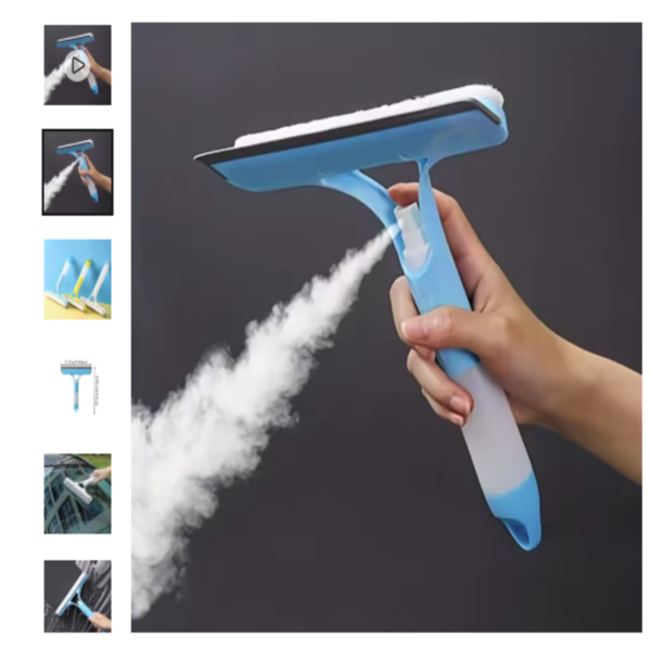 Limpiador de vidrio multifunción con spray integrado Mano sosteniendo un limpiador de vidrio multifunción azul mientras pulveriza una nube de líquido limpiador.