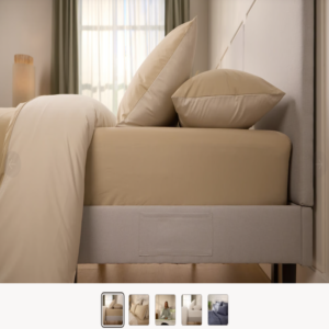 Sábana bajera percal Emma de color beige colocada en colchón de dormitorio